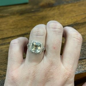 Silver and light green emerald cut ring